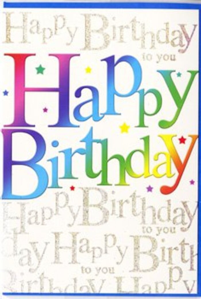The photo captures a contemporary birthday card standing neatly against a pale background, its design as lively and welcoming as walking past the flower stalls near Bexley's town centre. The card's main feature is the large Happy Birthday message that stretches almost edge to edge, each letter generously spaced and filled with a multicoloured gradient. The colours transition smoothly from warm tones of ruby red and magenta to bursts of orange and buttercup yellow, then into cool notes of spring green, teal, azure, and violet, echoing the way a florist might blend gerberas, roses, and lisianthus into one jubilant arrangement. Each letter looks solid yet slightly softened at the edges, with subtle shading that gives a sense of depth, as if they are gently raised from the card. Behind this bold rainbow text, the entire background is overlaid with flowing, looping gold script that repeats Happy Birthday to you in a continuous pattern. The calligraphy is delicate and fine, with a sparkling, glitter-like finish that catches the light in small, twinkling highlights, rather like sunlight glancing off the fountains in Danson Park. The repeated script remains faint enough not to compete with the central message, acting instead as a warm, celebratory whisper. Tiny specks and miniature starbursts of colour are scattered here and there, adding an extra sense of confetti, movement, and fun. The surface of the card appears smooth and slightly reflective, suggesting a high-quality, satin finish. Overall, the mood is upbeat and sincere, a perfect partner to a bright birthday bouquet delivered across Bexley to mark a special milestone with genuine cheer and care.