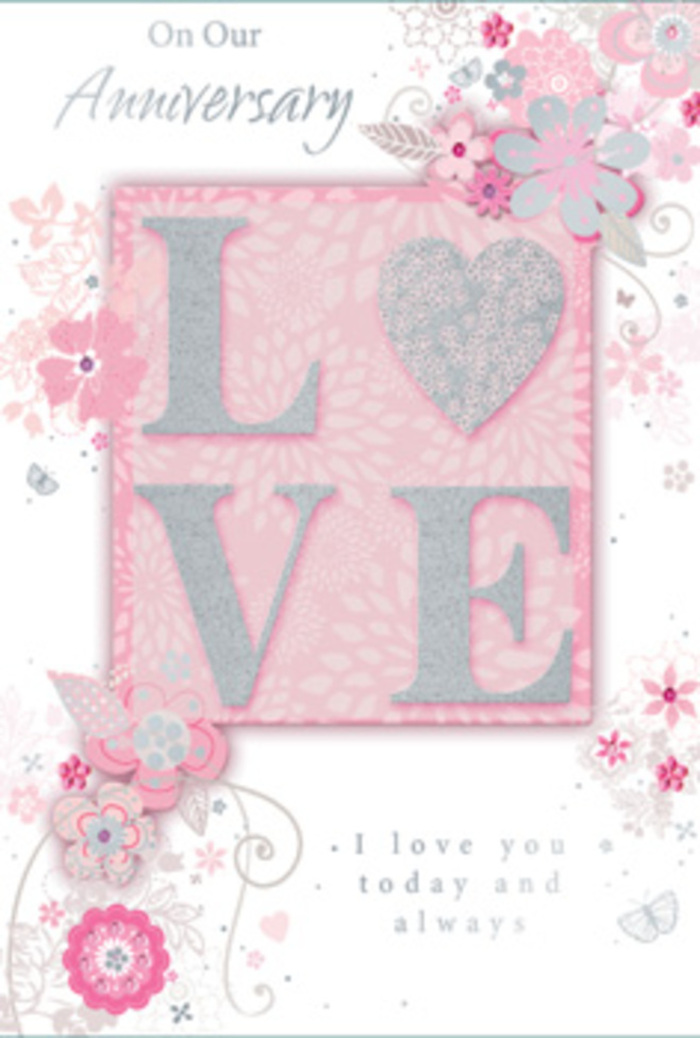 The anniversary card in the image feels like a paper bouquet carefully composed for a couple who has shared many peaceful evenings in Bexley. Dominating the centre is the word LOVE, printed in an elegant, slightly rounded typeface and lifted from the surface with a raised finish. A veil of fine glitter shimmers over the letters in tones of blush pink and soft silver, creating a frosted, pearlescent look that seems to glow in the kind of gentle light that might filter through curtains on a quiet morning near Bexleyheath. The letters appear touchably smooth yet delicately textured, suggesting a tactile delight when held in the hand. Around this central motif, airy clusters of stylised flowers and foliage drift across a pale pink background, as if caught on a light breeze coming off the nearby parkland. The blossoms are drawn with a florist's sense of balance: some fully open, others in bud, all rendered in fine lines and soft shading of pink, ivory, and dove grey, with tiny highlights of silver foil that catch the eye like dewdrops. Spiralling tendrils and graceful leaves trace gentle arcs, framing the central word without crowding it. Subtle script phrases curve along the composition, bearing sentiments of enduring affection and anniversary blessings in a refined, flowing hand. The overall atmosphere is calm, romantic, and gently celebratory, echoing the feeling of receiving a bespoke anniversary arrangement from a trusted local florist. It is a card that visually whispers of constancy, tenderness, and the quiet joy of another year shared side by side.